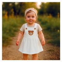 Niemowlęca sukieneczka na szelkach New Baby Luxury clothing Laura biała