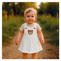 Niemowlęca sukieneczka na szelkach New Baby Luxury clothing Laura biała
